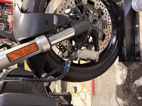 Front wheel and forks of the Ducati Monster 821 on the lift