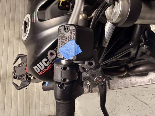 Right control cluster and brake reservoir with blue tape